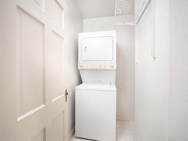 washroom with stacked washer / dryer