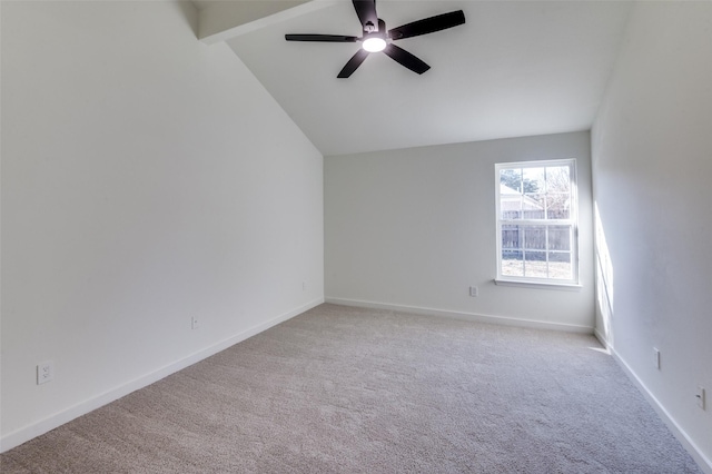 carpeted empty room with vaulted ceiling with beams and ceiling fan