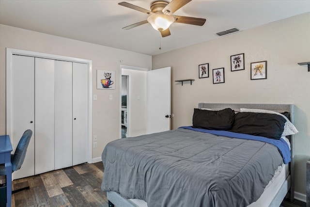 bedroom with ceiling fan, dark hardwood / wood-style flooring, and a closet