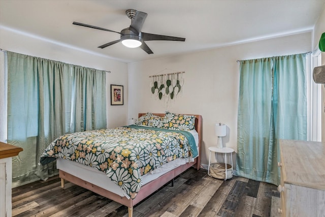 bedroom featuring ceiling fan and dark hardwood / wood-style floors