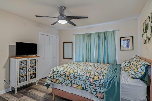 bedroom with ceiling fan, dark hardwood / wood-style flooring, and a closet