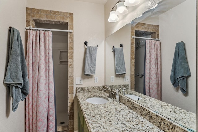 bathroom with vanity and walk in shower