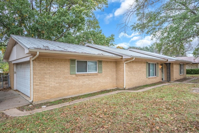 view of property exterior with a garage and a yard