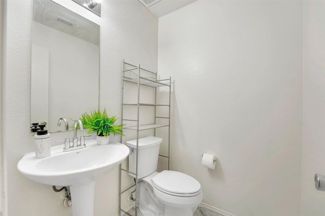 bathroom with sink and toilet