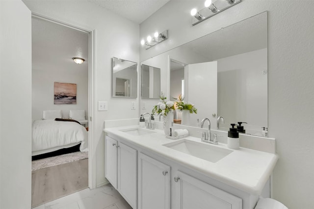 bathroom featuring vanity and a textured ceiling