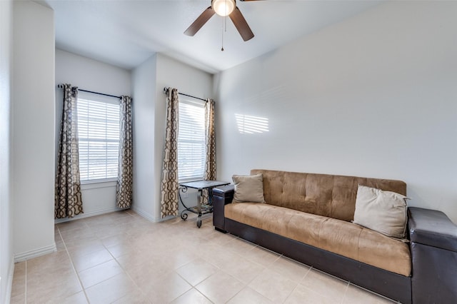 tiled living room featuring ceiling fan