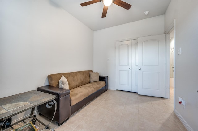 sitting room with light tile patterned floors and ceiling fan