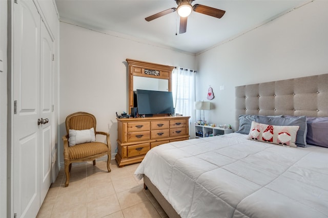 bedroom featuring ceiling fan and light tile patterned flooring