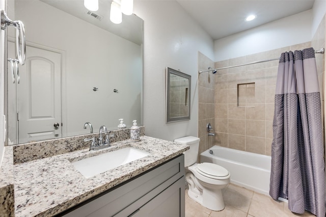 full bathroom with shower / tub combo, vanity, toilet, and tile patterned flooring