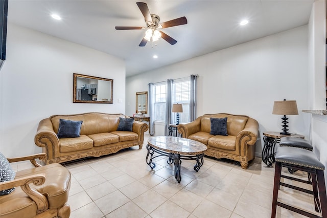 tiled living room featuring ceiling fan