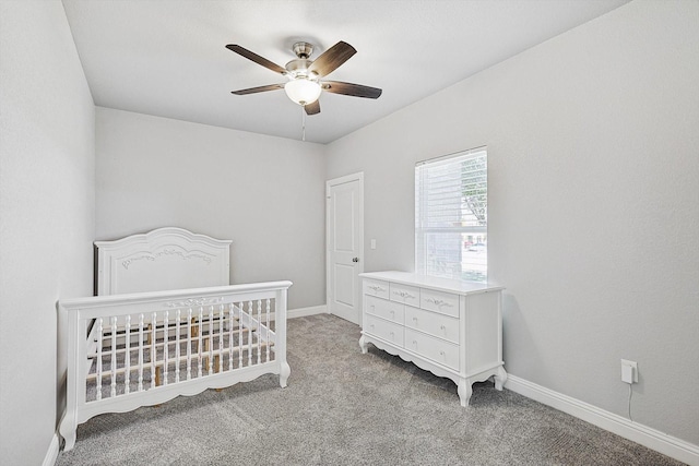 bedroom featuring light colored carpet and ceiling fan