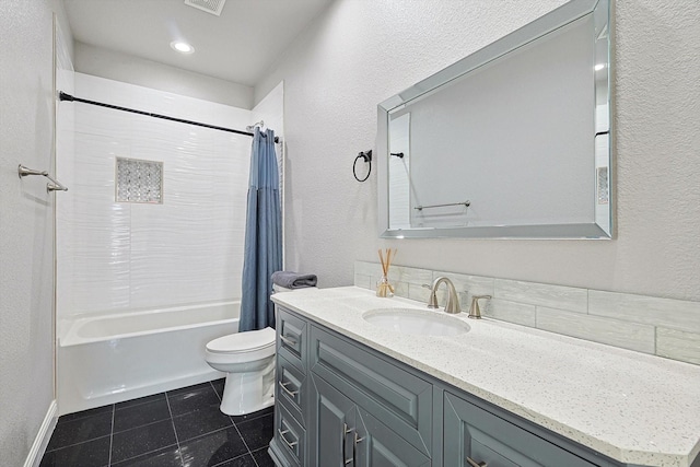 full bathroom featuring vanity, toilet, tile patterned flooring, and shower / bath combo with shower curtain