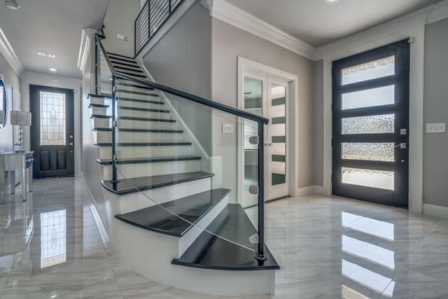 foyer featuring crown molding