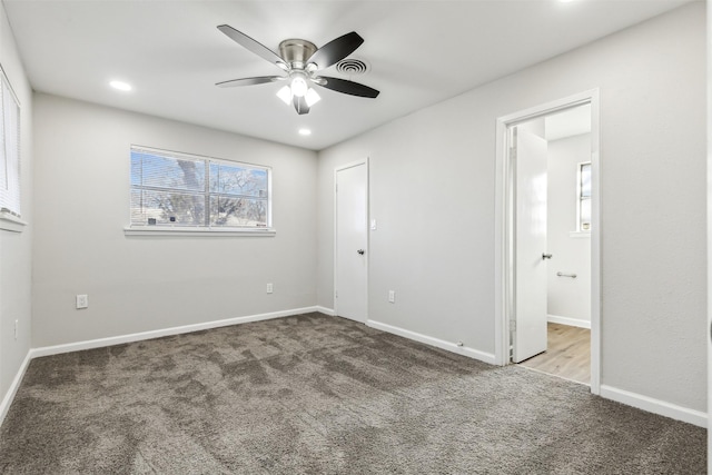 unfurnished bedroom featuring ceiling fan and carpet