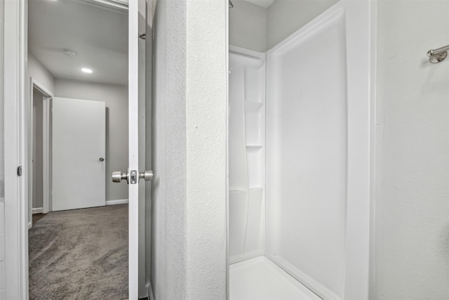 bathroom featuring walk in shower