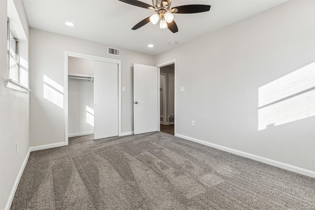 unfurnished bedroom featuring a closet, ceiling fan, and carpet flooring