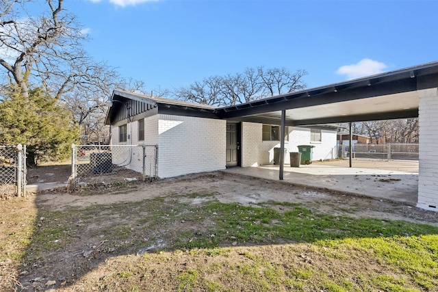 view of side of home featuring a carport