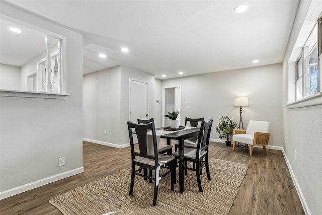 dining area featuring dark hardwood / wood-style flooring