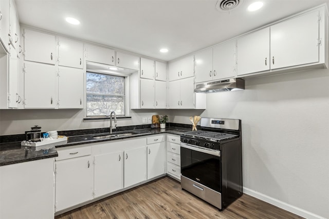 kitchen featuring sink, stainless steel range with gas stovetop, and white cabinets