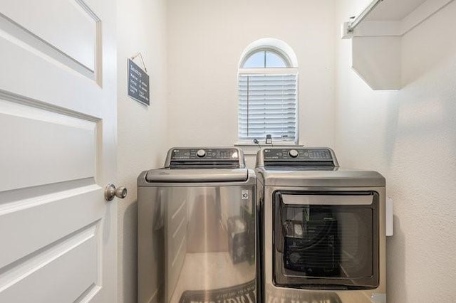 laundry room with separate washer and dryer