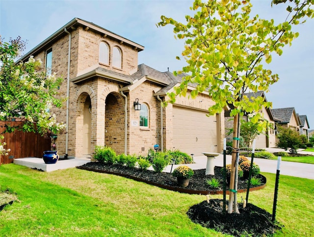 view of front of home featuring a garage and a front lawn