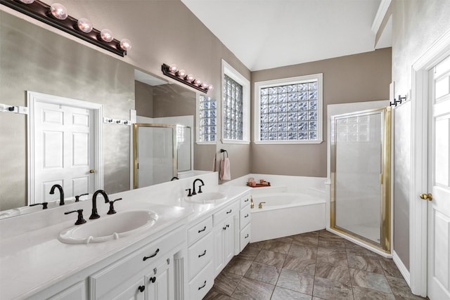 bathroom featuring vanity and separate shower and tub