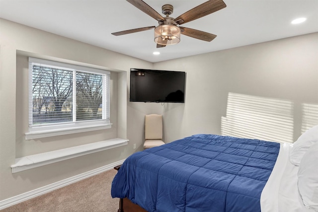 carpeted bedroom with ceiling fan