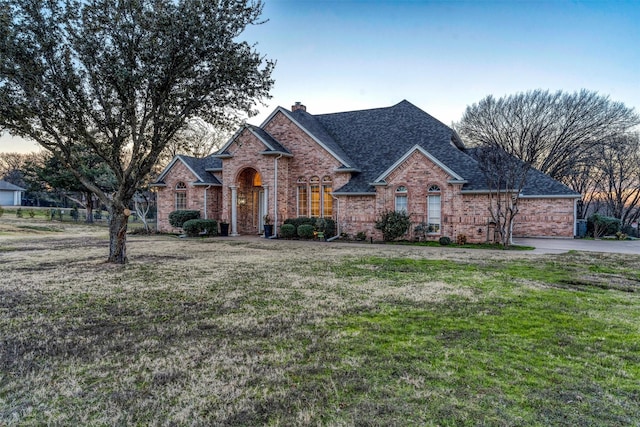 view of front of house with a lawn