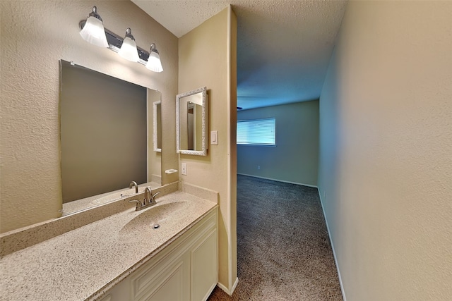 bathroom featuring vanity and a textured ceiling