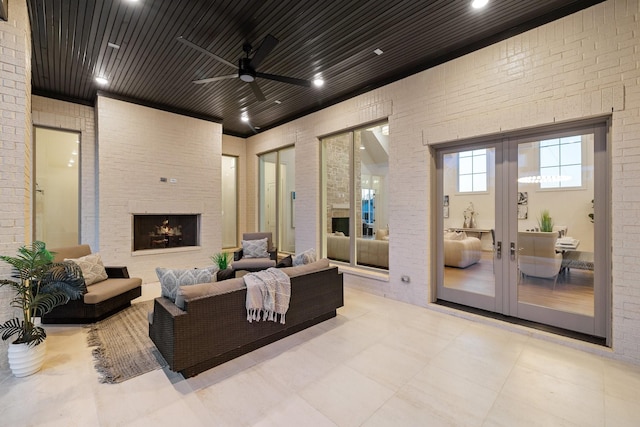 view of patio / terrace featuring an outdoor living space, french doors, and ceiling fan