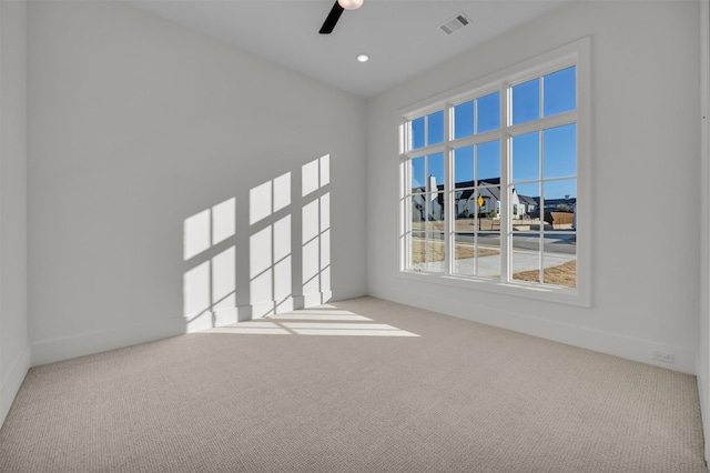 carpeted empty room with ceiling fan