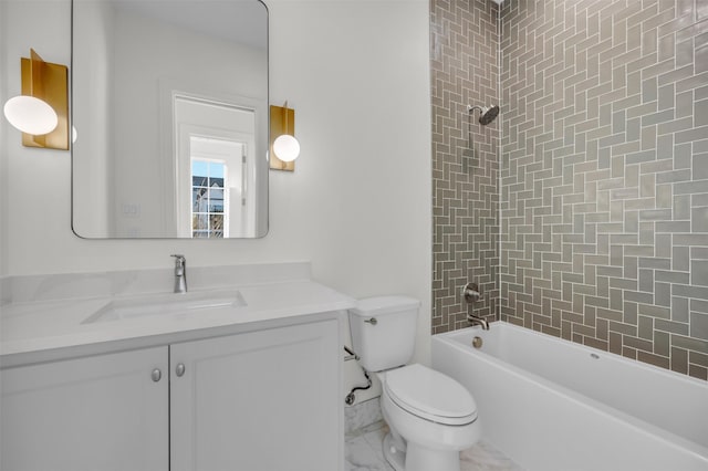 full bathroom with tiled shower / bath, vanity, and toilet