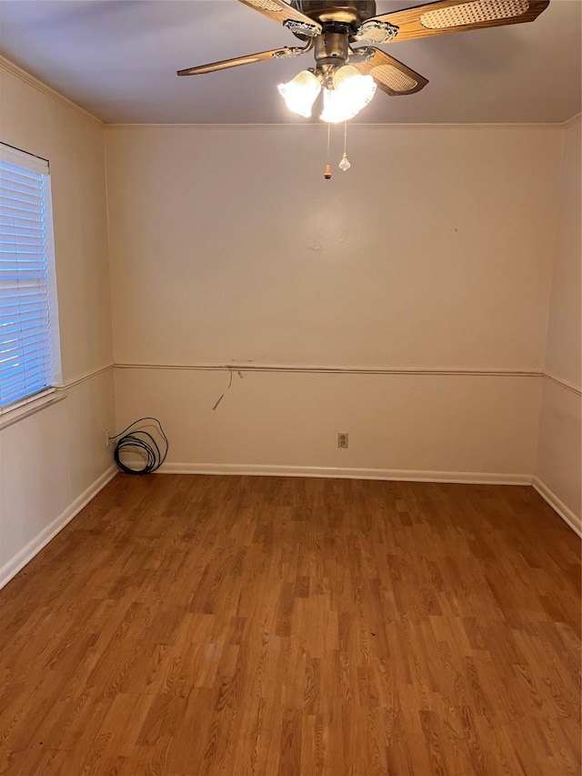 empty room featuring wood-type flooring and ceiling fan