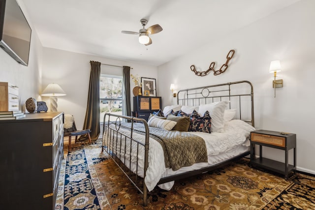 bedroom featuring baseboards and a ceiling fan