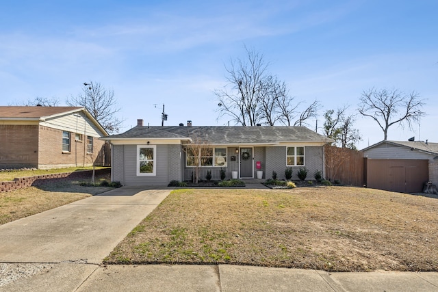 ranch-style house with fence, a front lawn, and brick siding