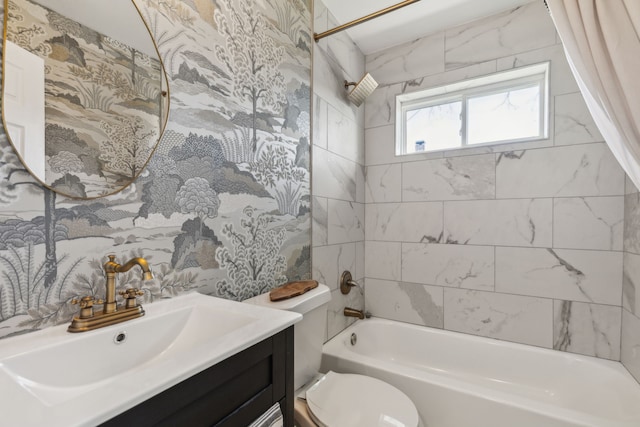 bathroom featuring tub / shower combination, vanity, and toilet