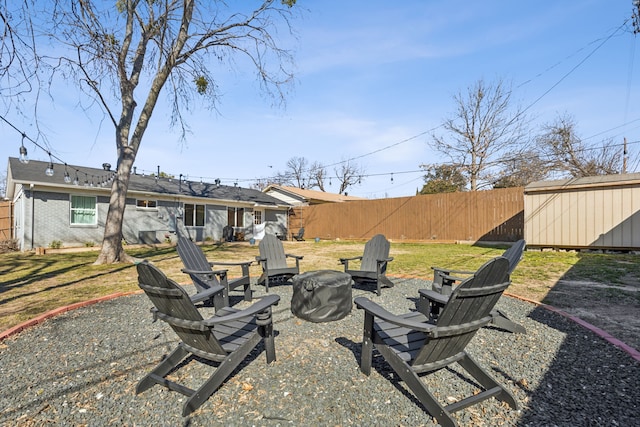 view of yard with an outdoor fire pit