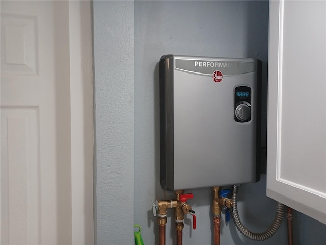 utility room with water heater