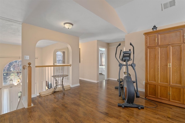 workout room with dark hardwood / wood-style flooring