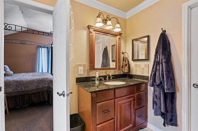 bathroom featuring ornamental molding, vanity, and backsplash