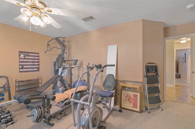 workout area with a textured ceiling