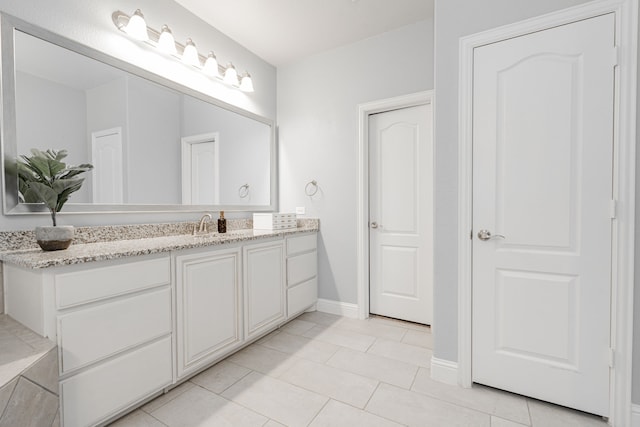 bathroom featuring vanity and tile patterned flooring