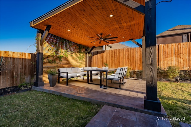 view of patio featuring ceiling fan