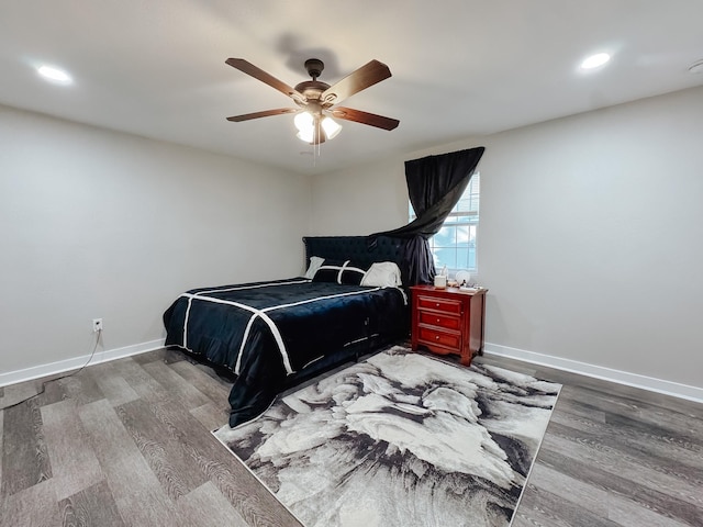 bedroom featuring hardwood / wood-style flooring and ceiling fan