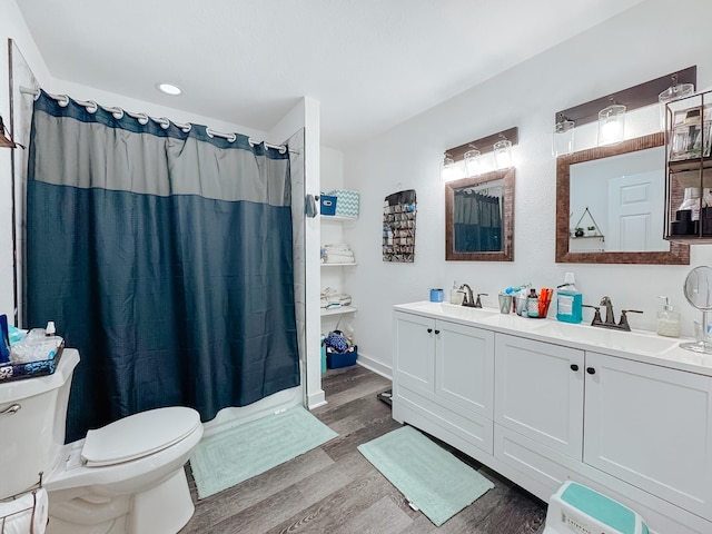 bathroom with vanity, a shower with curtain, wood-type flooring, and toilet