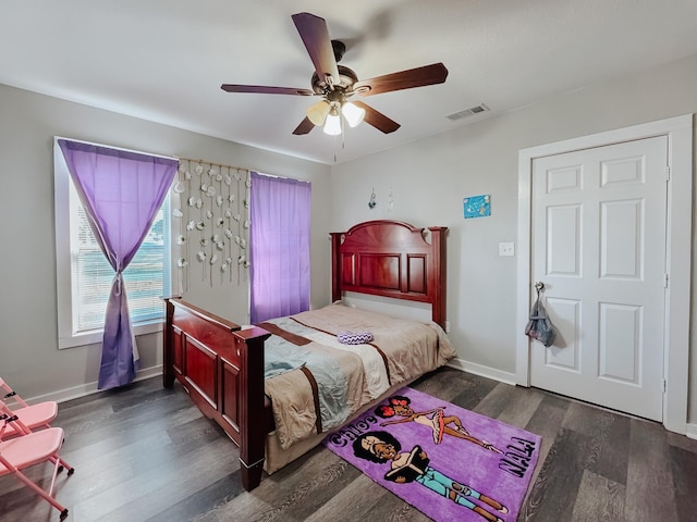 bedroom featuring dark wood-type flooring and ceiling fan