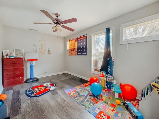 game room with hardwood / wood-style flooring and ceiling fan