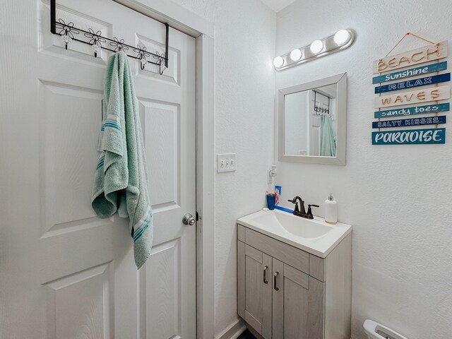 bathroom featuring vanity and a baseboard heating unit