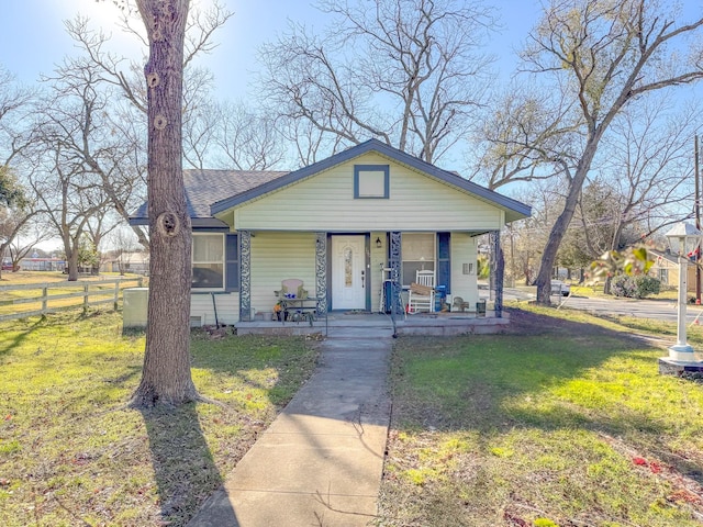 view of front of house featuring a front yard and a porch