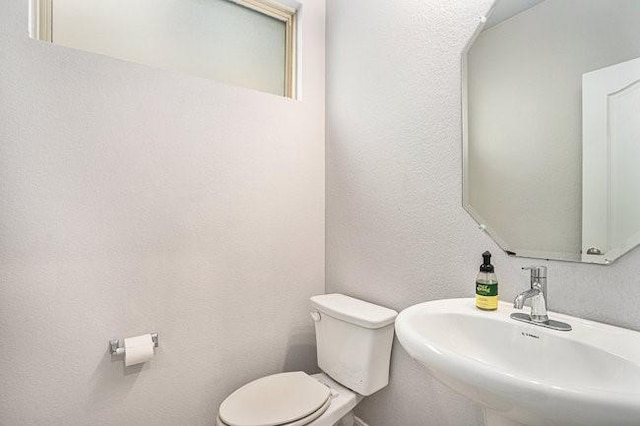 bathroom with sink and toilet